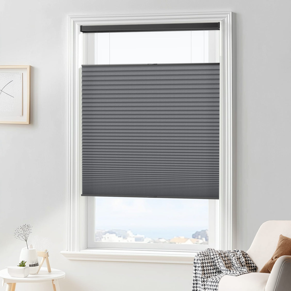 Dark gray top-down bottom-up cellular honeycomb shade: in a furnished room
