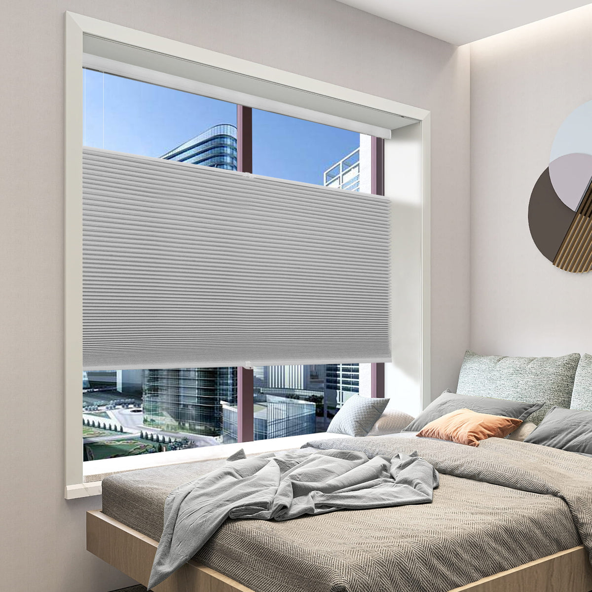 Gray top-down bottom-up cellular honeycomb shade: in a bedroom