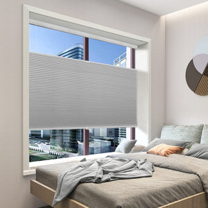 Gray top-down bottom-up cellular honeycomb shade: in a bedroom