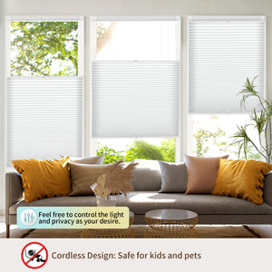 Light gray top-down bottom-up no-drill cellular honeycomb shade: above a window seat