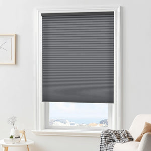 Dark gray cellular honeycomb shade: in a furnished room