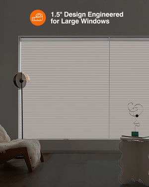 Cream cellular honeycomb shade: in a furnished room