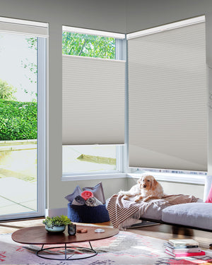 Gray top-down bottom-up no-drill cellular honeycomb shade: in a furnished room