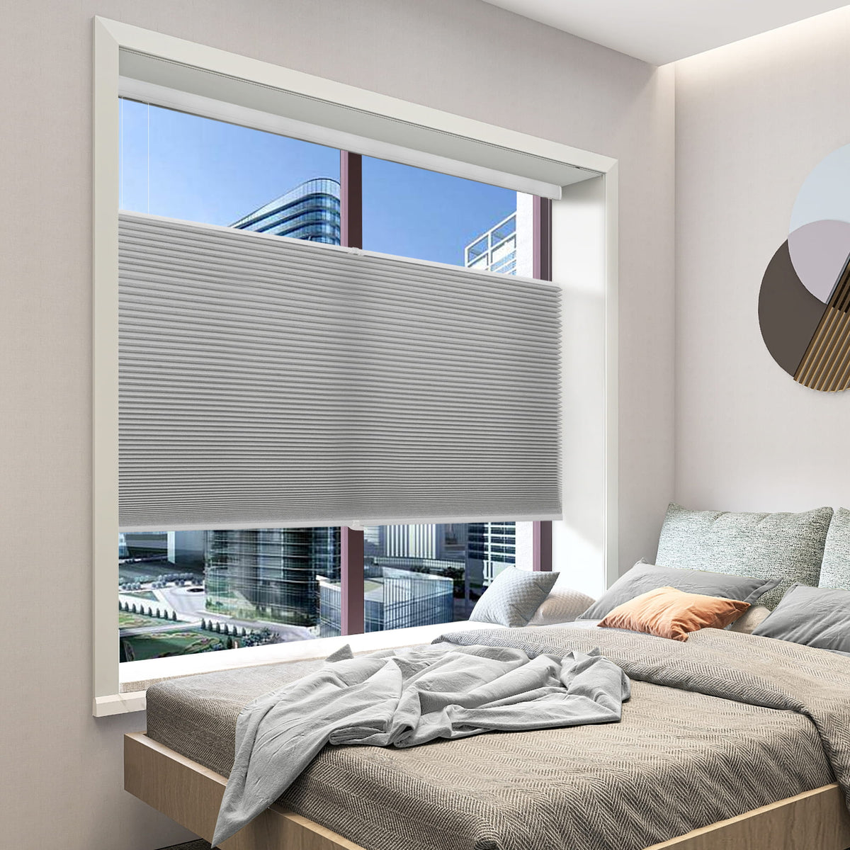 Gray top-down bottom-up cellular honeycomb shade: in a bedroom