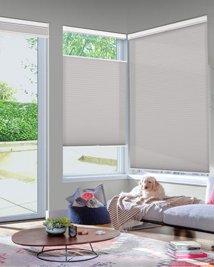 Gray top-down bottom-up no-drill cellular honeycomb shade: in a furnished room