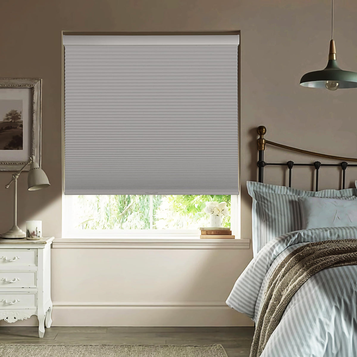 White cellular honeycomb shade: in a bedroom