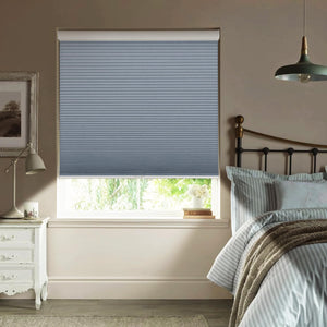 Blue cellular honeycomb shade: in a bedroom