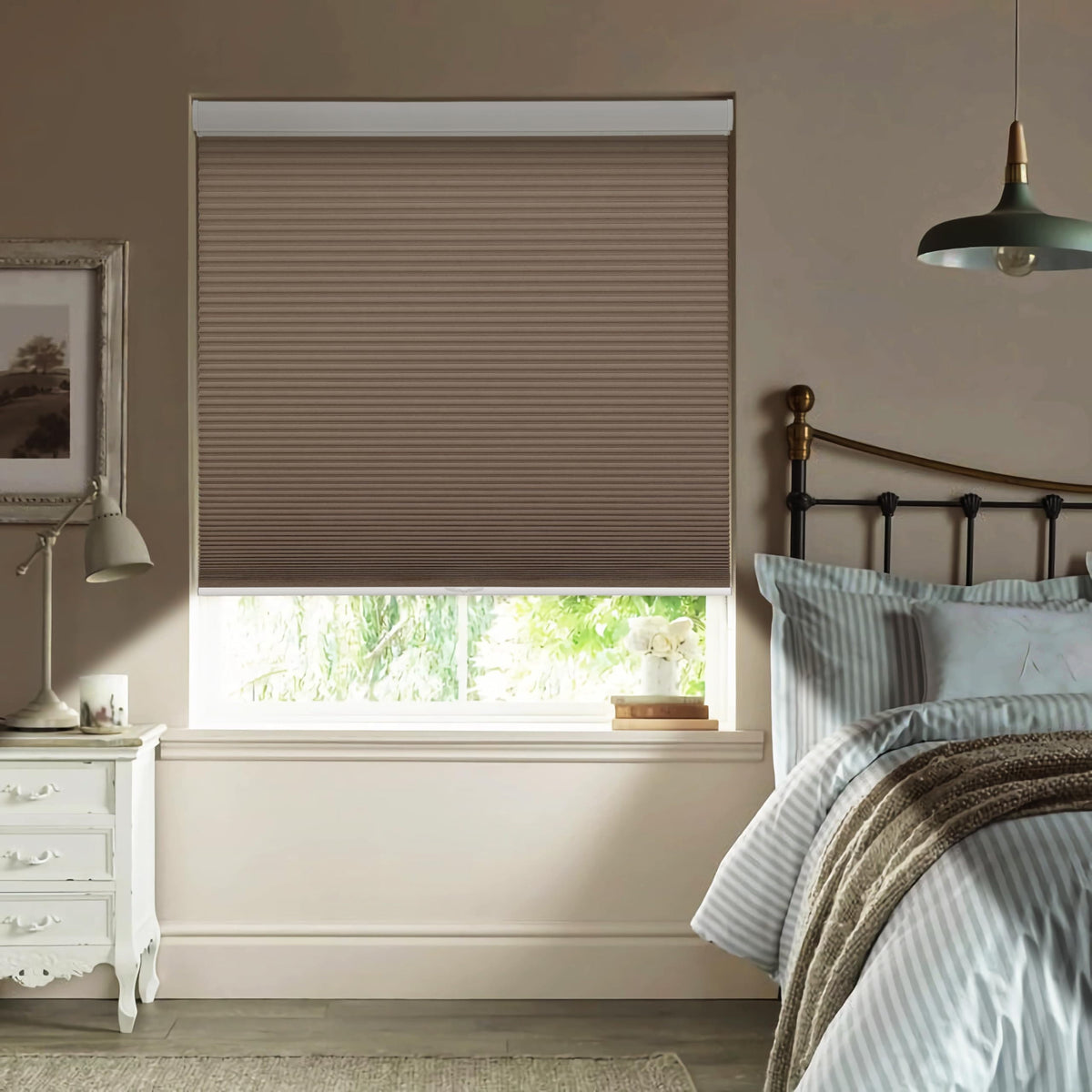 Brown cellular honeycomb shade: in a bedroom