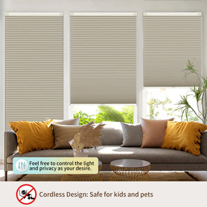 Beige no-drill cellular honeycomb shade: above a window seat