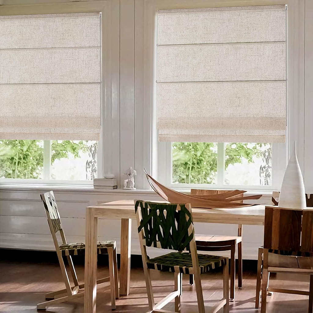 Light-filtering Roman shades beside a dining table