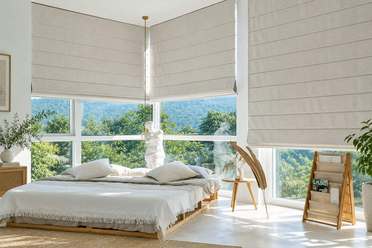 Neutral Roman shades for large floor-to-ceiling bedroom windows