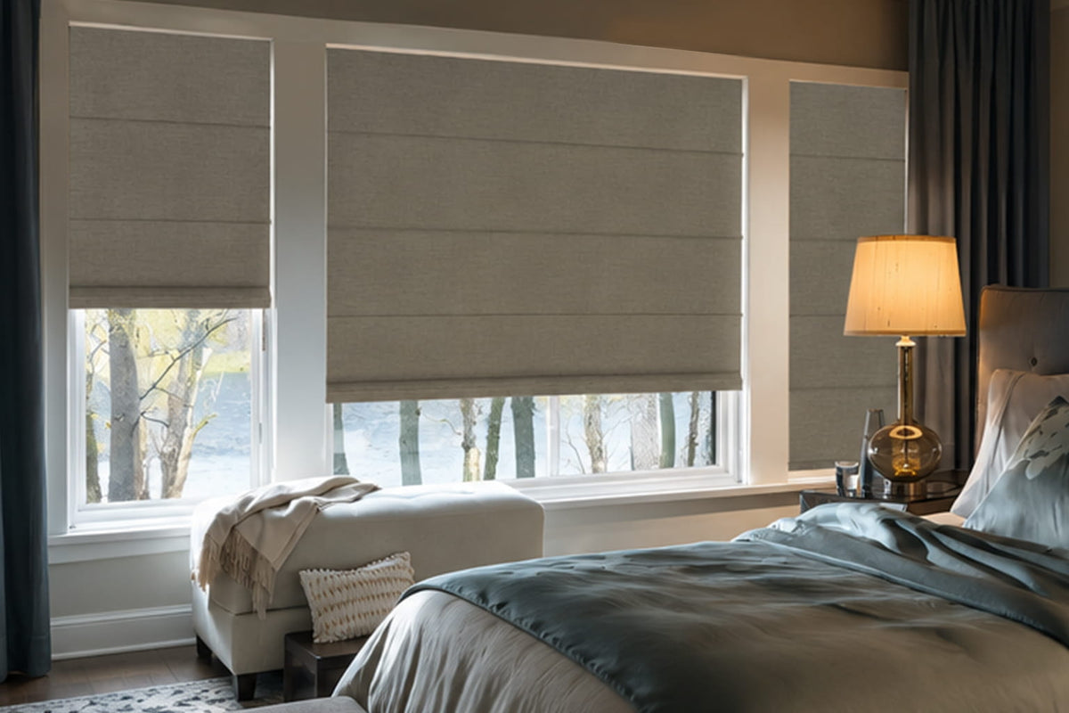 Room darkening Roman shades on large bedroom windows