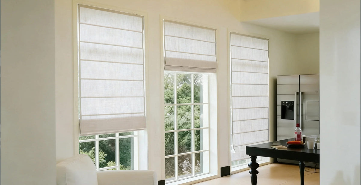 White Roman shades in a bright living room